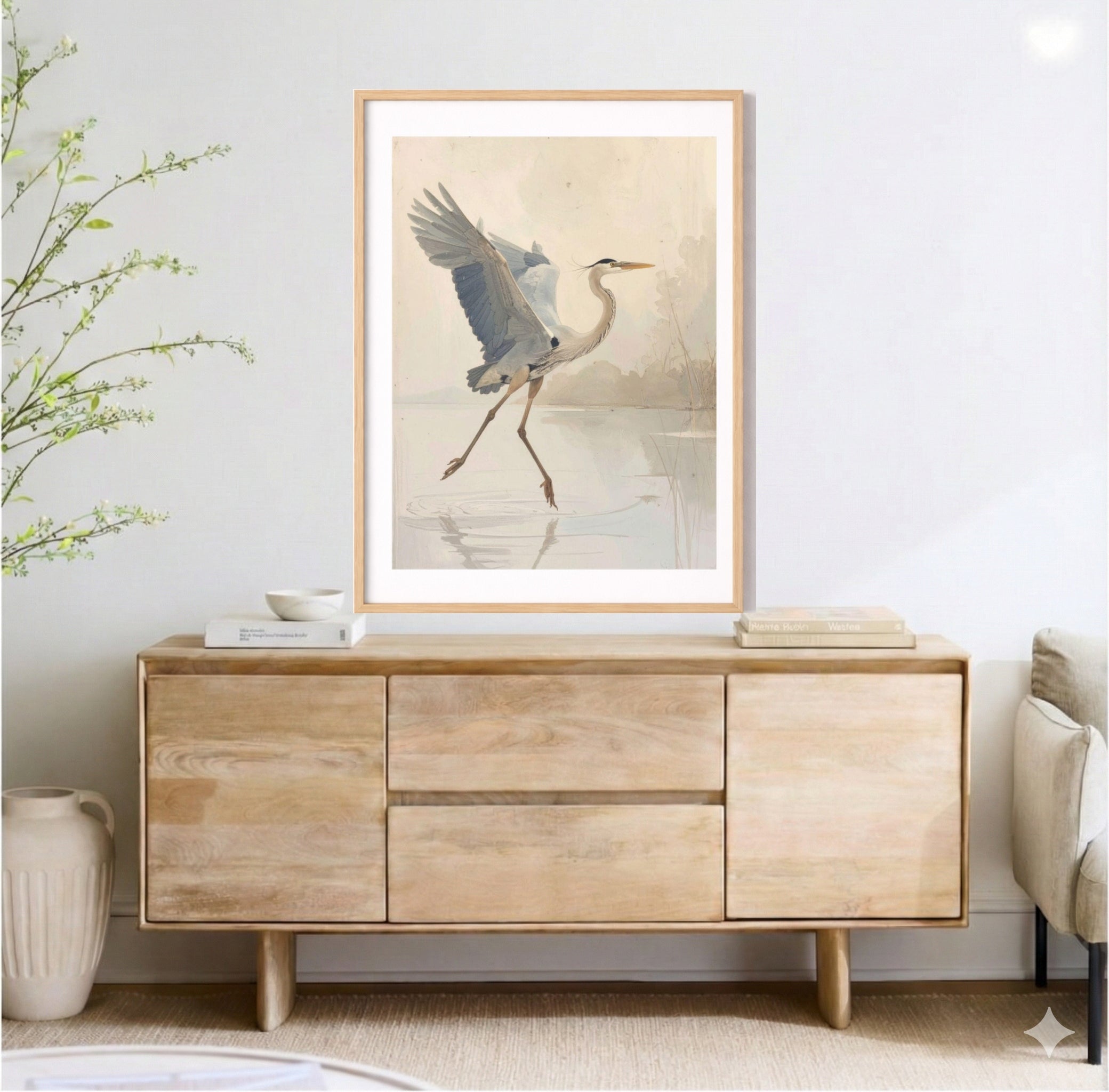Neutral heron wall art above wood sideboard, light airy living room decor, coastal modern farmhouse style, framed bird print, soft beige minimalist interior, serene nature artwork.