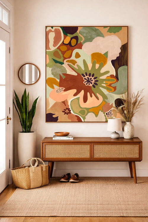 Savvy Places abstract floral wall art in warm neutral tones styled above a console table.