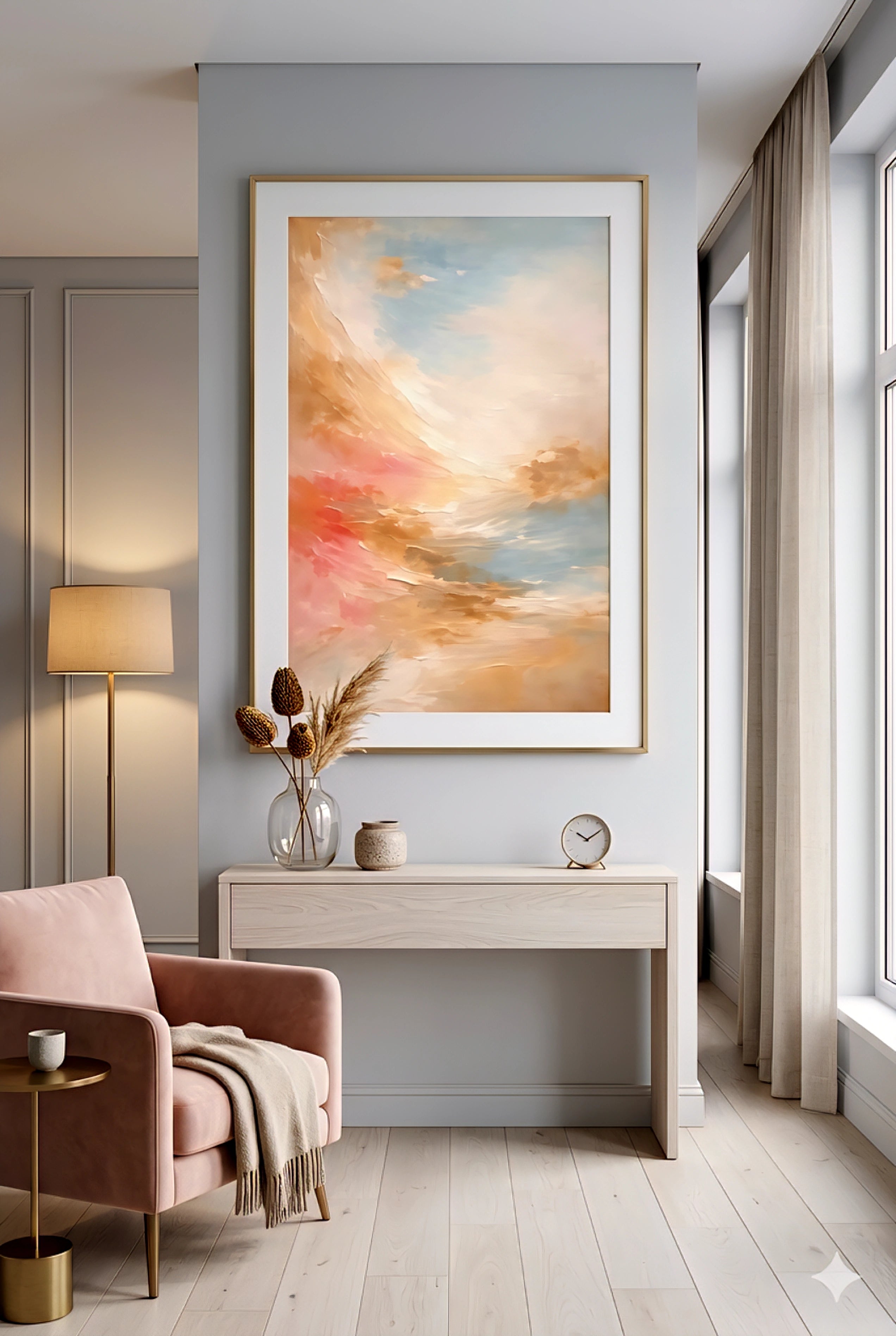 Soft coastal printable abstract wall art with coral, peach, and blue tones above console table, styled in a light neutral living space with blush chair and airy decor