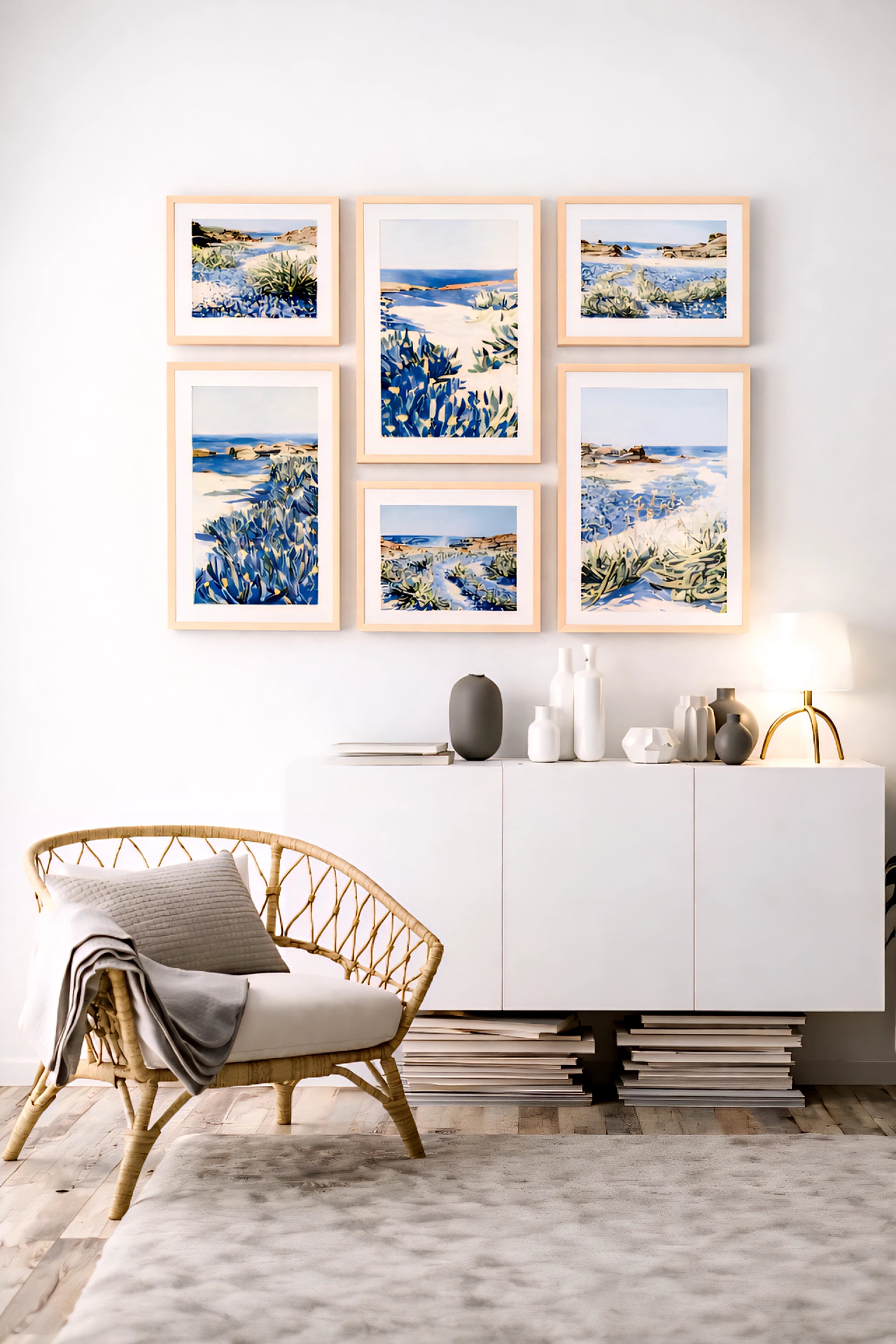Coastal gallery wall printable art bundle with blue seascape prints in light wood frames creating a soft modern neutral living room decor layout