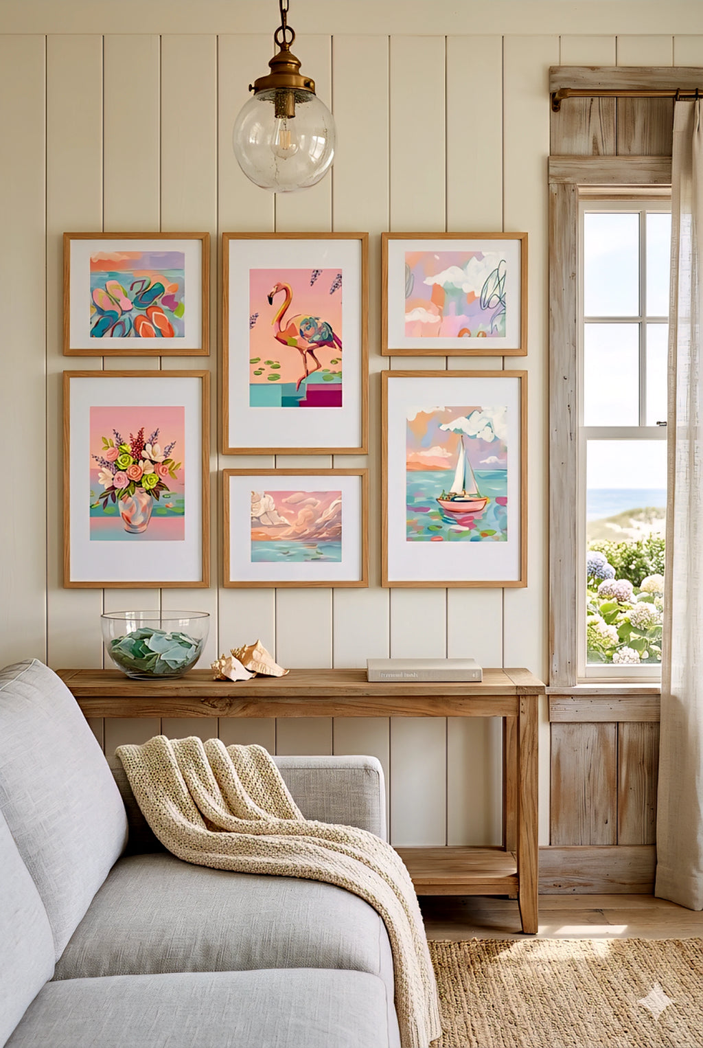 Digital download coastal gallery wall set in cottage living room, pastel beach prints with flamingo, sailboat and florals above console table