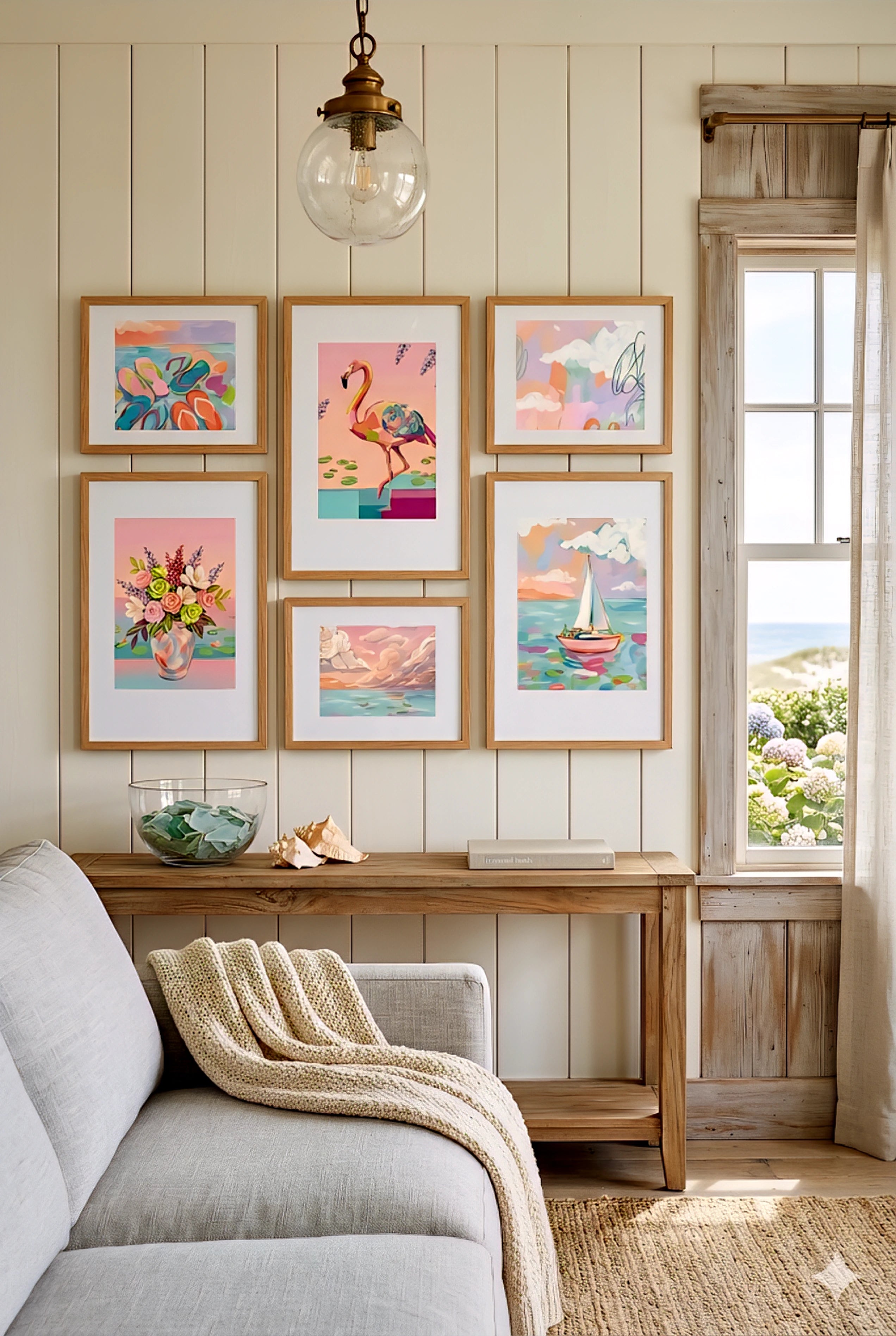 Digital download coastal gallery wall set in cottage living room, pastel beach prints with flamingo, sailboat and florals above console table