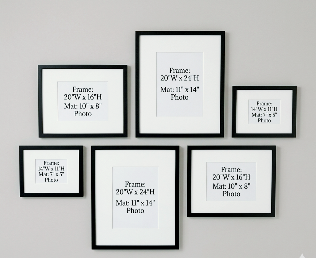Set of six black picture frames with dimensions on a gray wall.