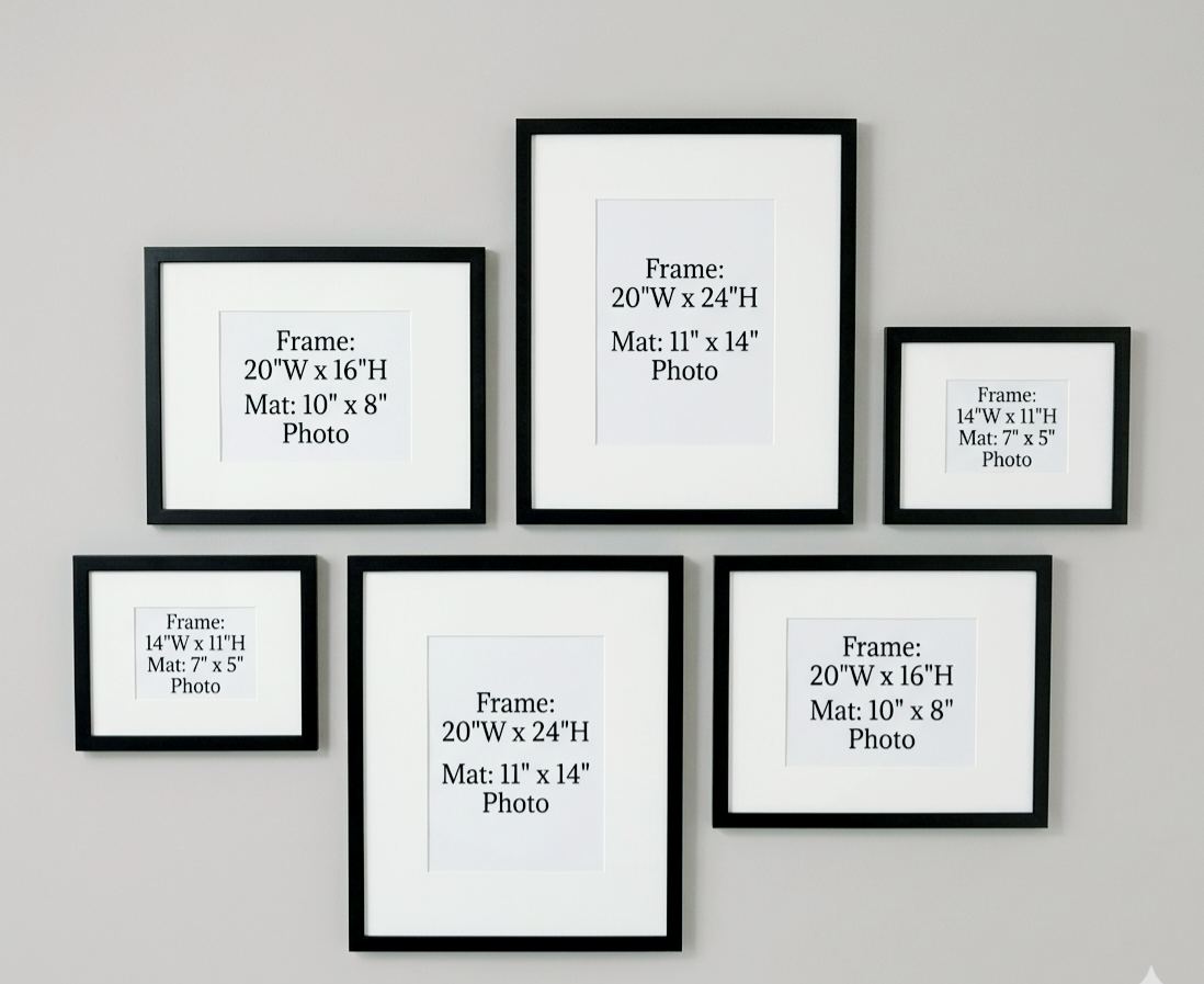 Set of six black picture frames with dimensions on a gray wall.