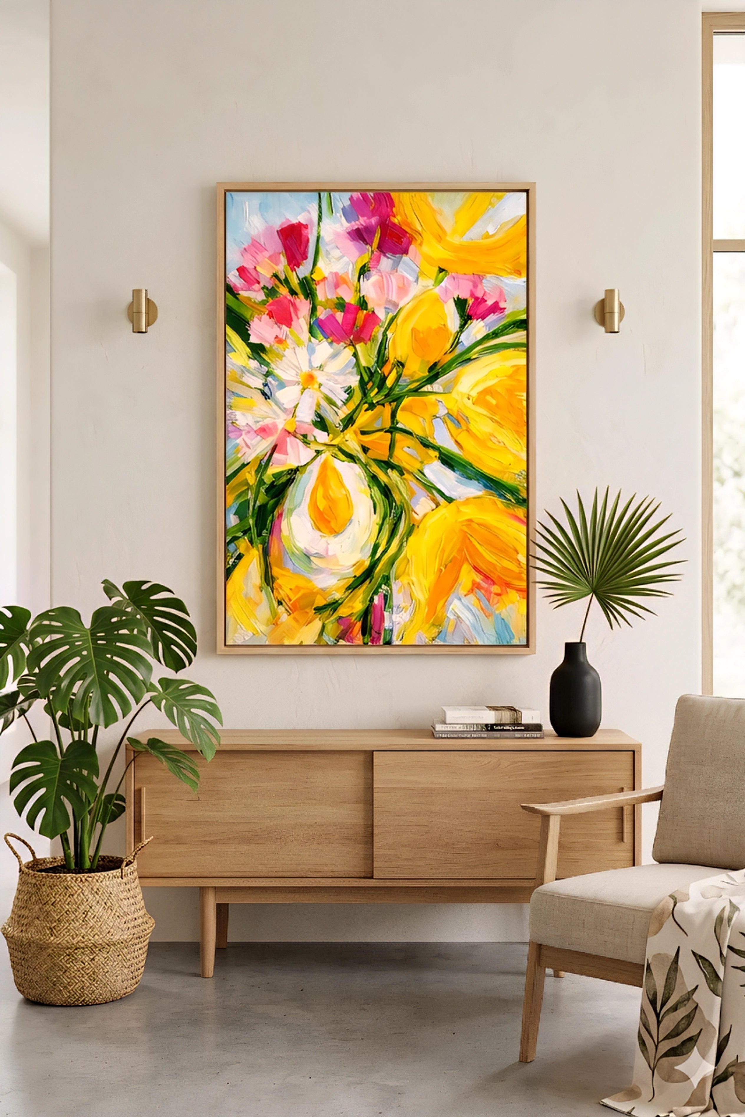 Yellow and pink floral abstract wall art above a modern wood sideboard with greenery and neutral decor, adding a bold color focal point to a clean, minimalist living room decorinspo