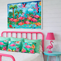Colorful flamingo-themed room with pink bed, lamp, and wall art.