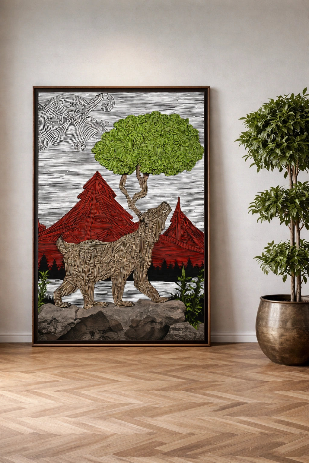 Framed artwork of a bear and mountains on a wall in a room with a plant.