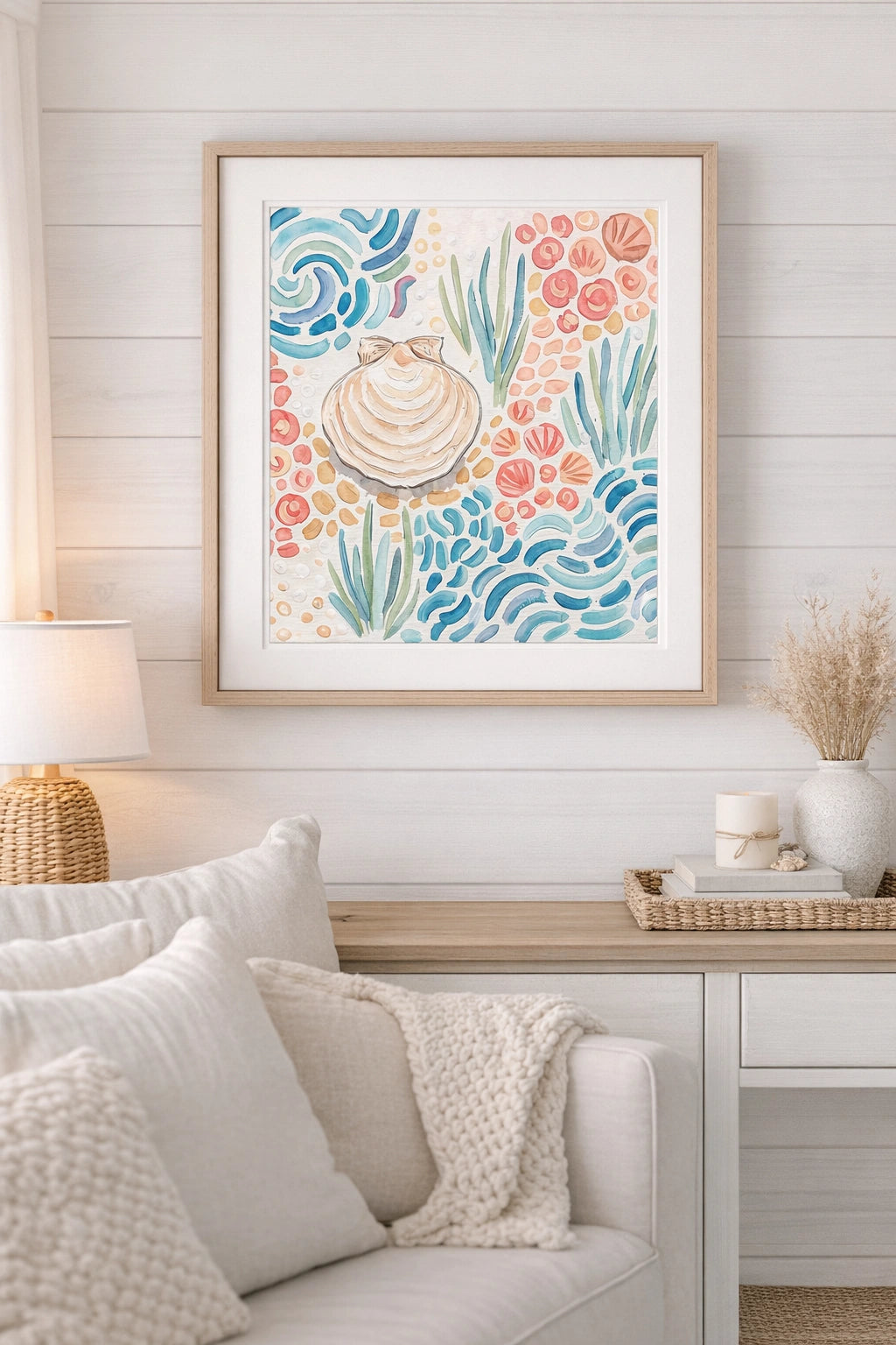 Framed artwork with seashell and aquatic design in a living room setting.