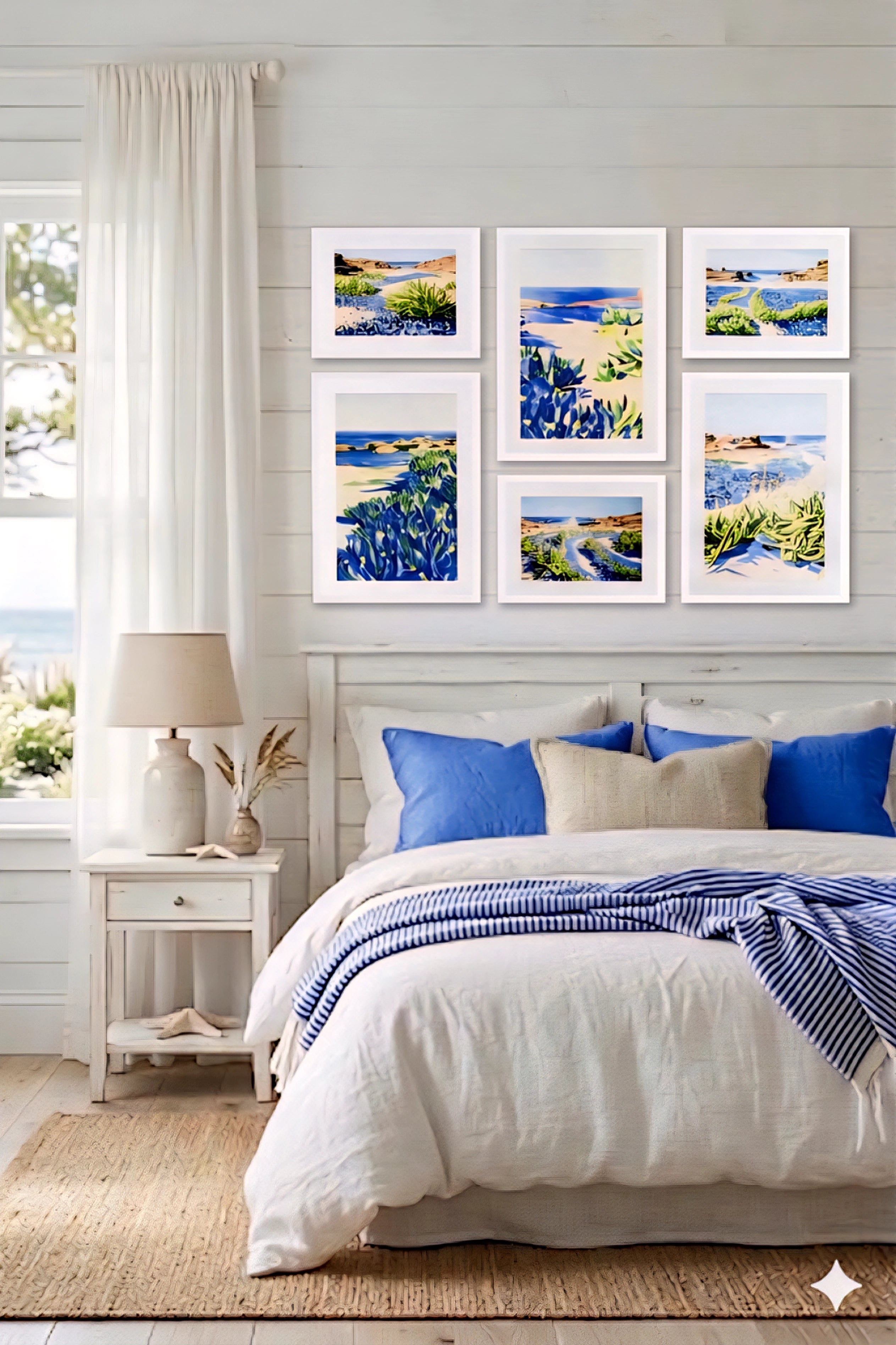 Coastal gallery wall printable art bundle with blue seascape prints in white frames styled above bed creating a bright airy beach house bedroom decor layout