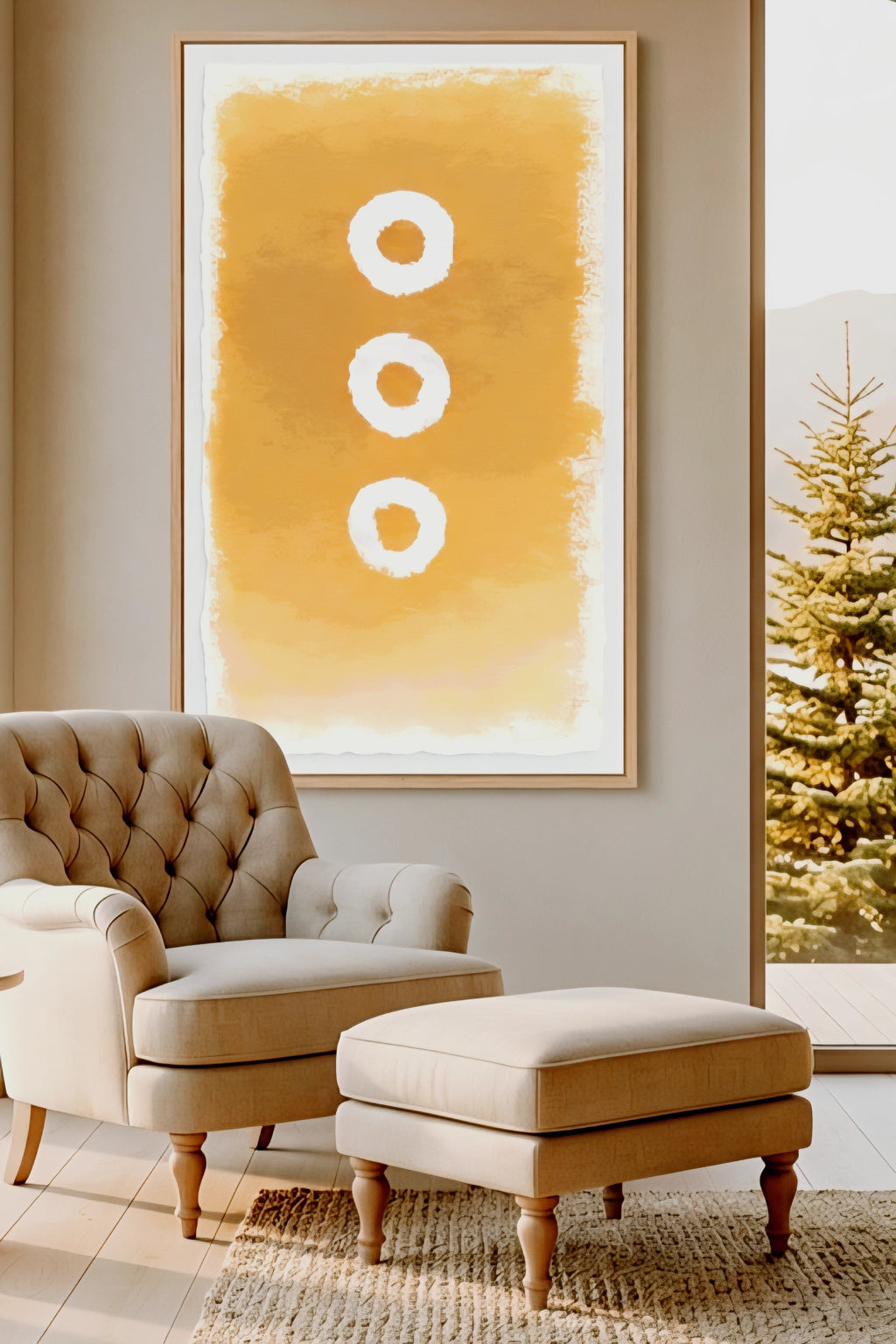 Large abstract wall art printable in warm golden earth tones with three circular shapes, displayed above a tufted armchair and ottoman in a cozy modern living room, oversized 9:16 vertical wall decor