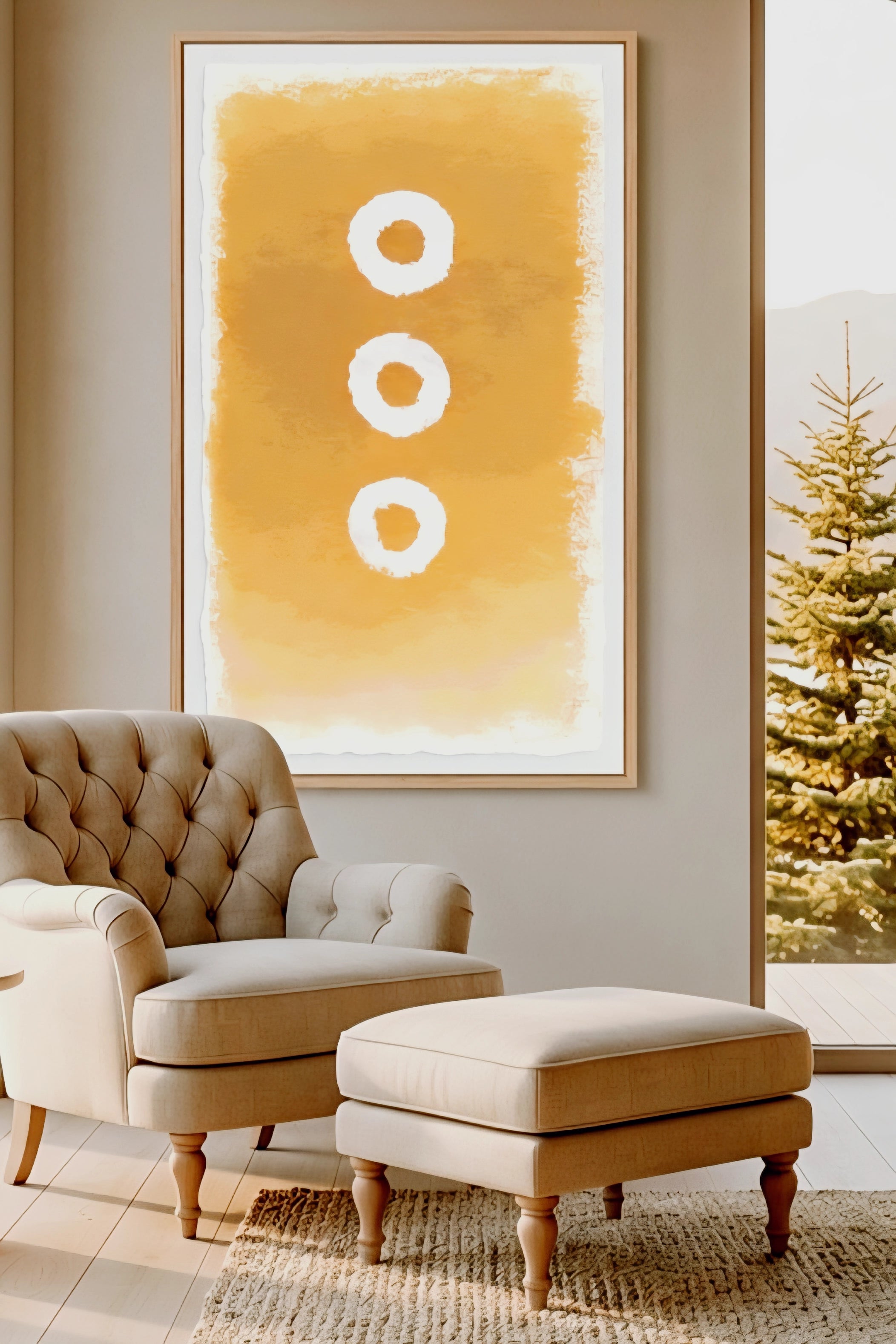 Large abstract wall art printable in warm golden earth tones with three circular shapes, displayed above a tufted armchair and ottoman in a cozy modern living room, oversized 9:16 vertical wall decor