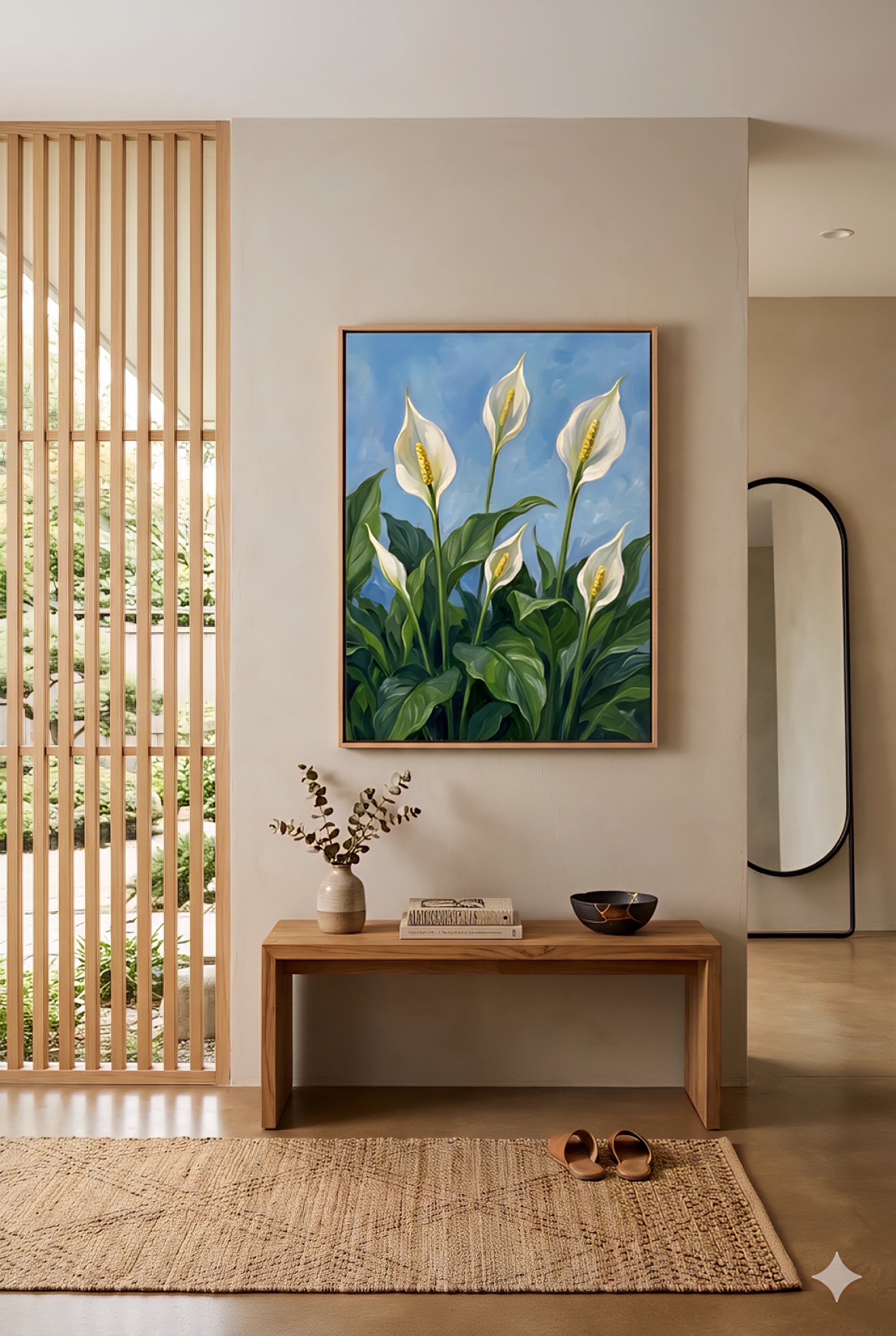 Framed peace lily botanical wall art with white blooms and green leaves on a blue background styled above a wooden bench in a modern entryway, printable digital download