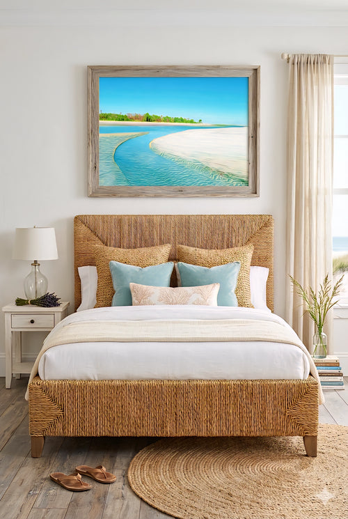 Coastal beach wall art above woven rattan bed in neutral bedroom with turquoise ocean print, sandy shoreline artwork, and soft coastal decor accents for a light, airy space
