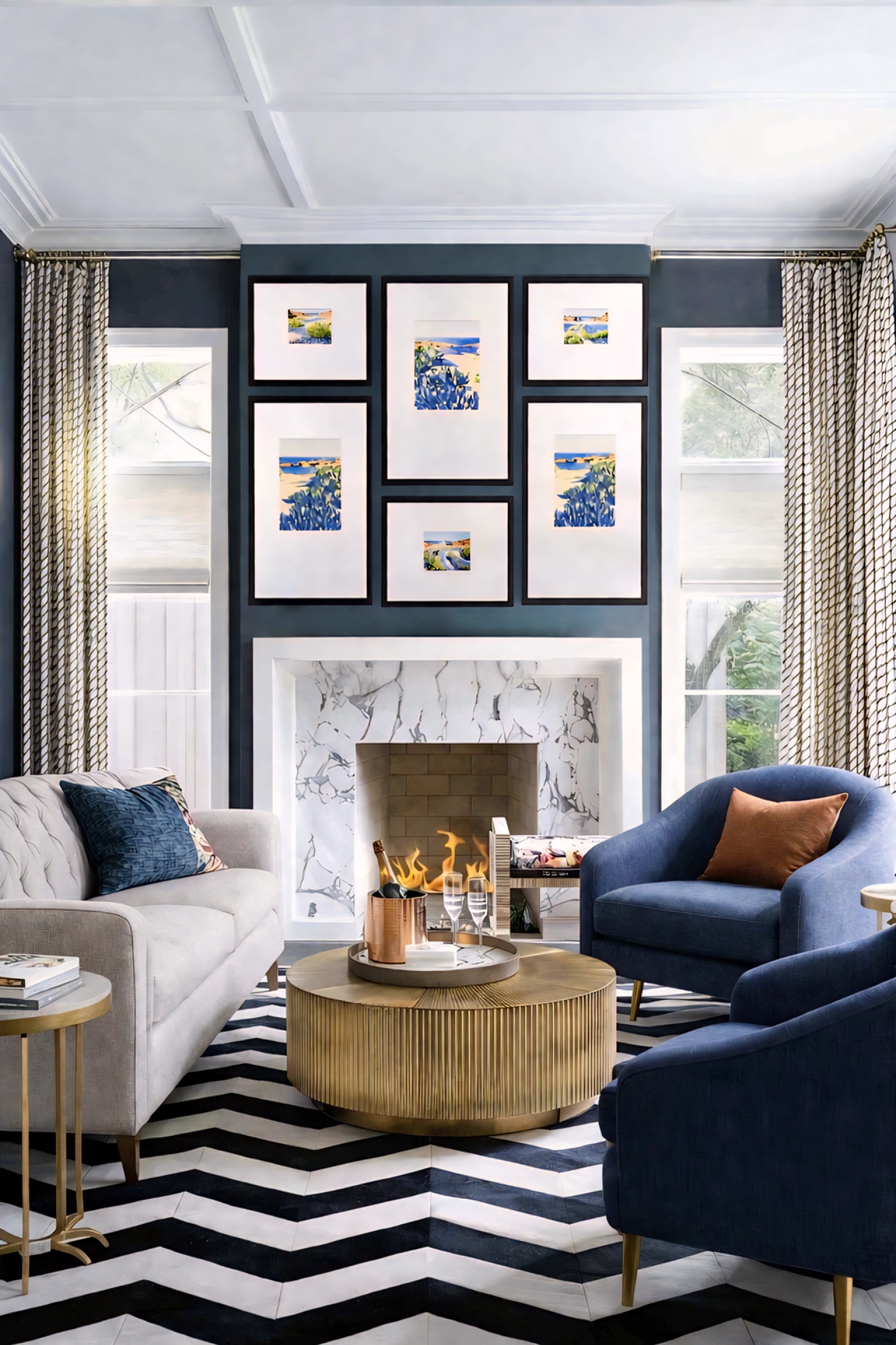 Coastal gallery wall printable art bundle displayed above fireplace with blue seascape prints in black frames creating a bold modern living room focal point decor