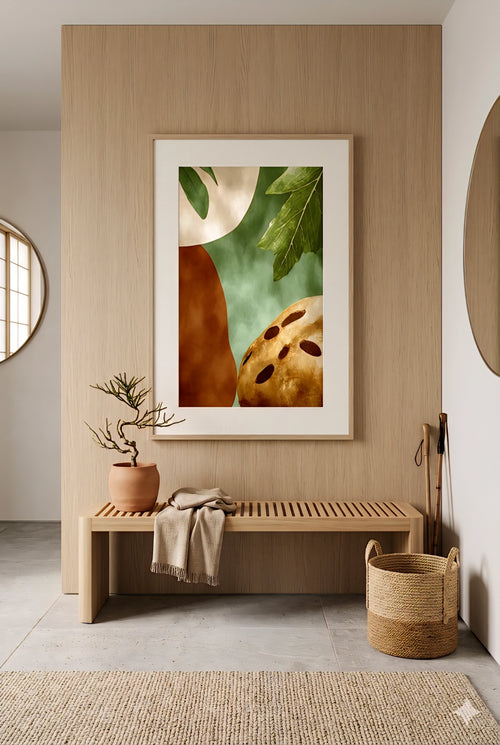 Earth tone abstract botanical wall art with green leaves and terracotta shapes styled in a minimalist entryway, vertical framed digital print above wood slat bench with neutral decor, woven basket and natural textures for warm modern Scandinavian home design