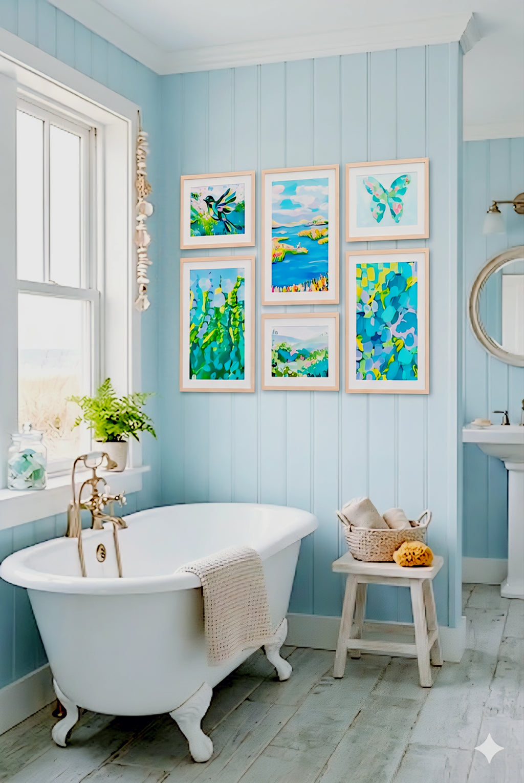 coastal gallery wall printable set styled in light blue beach house bathroom above tub, blue green artwork creating fresh coastal decor look