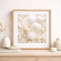 Framed artwork of white seahells  on a wooden surface with decorative items.
