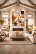 Savvy Places coastal bird wall art featuring white herons styled above a fireplace in a warm modern living room with natural textures.