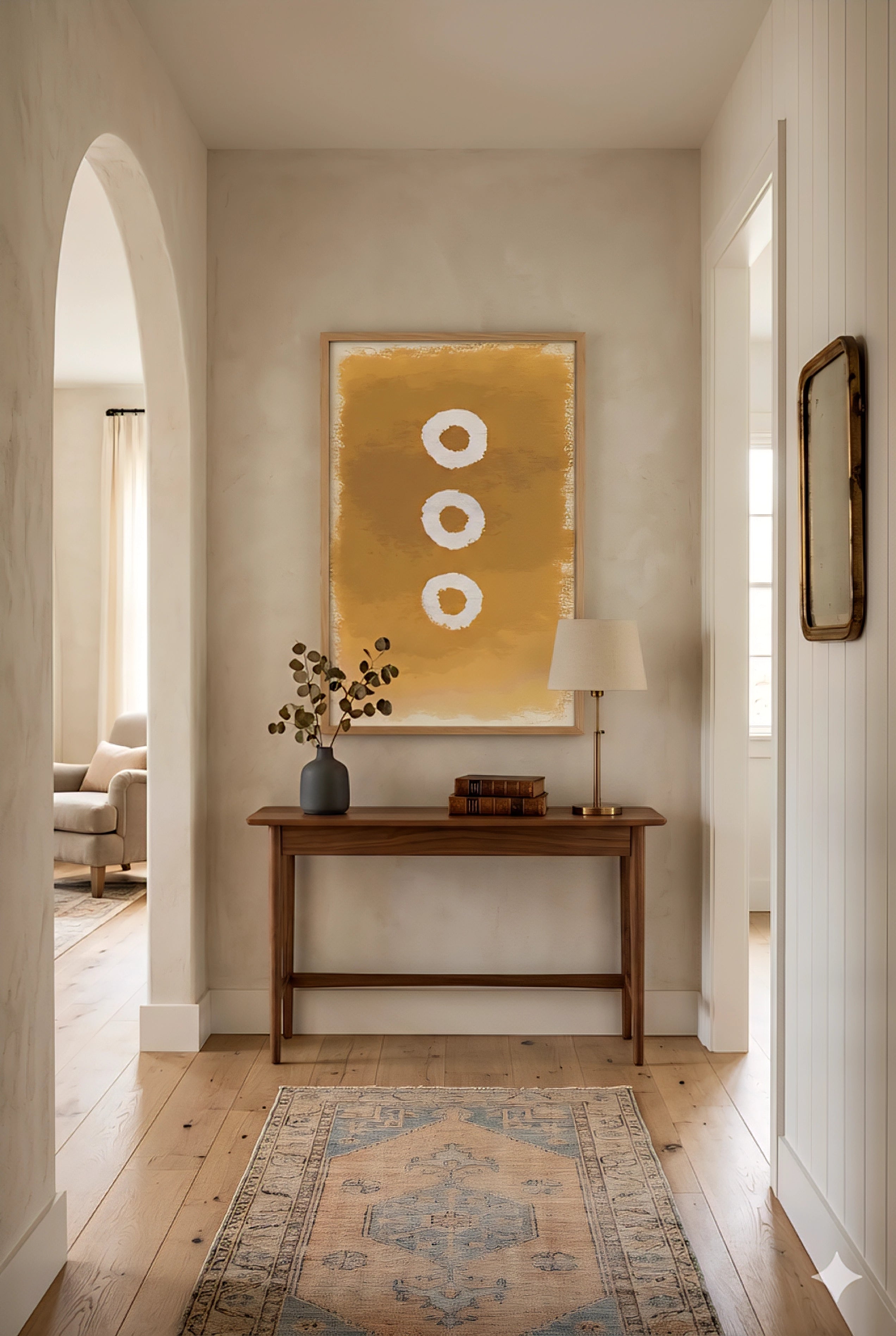 Large abstract wall art printable in warm golden earth tones with three circular shapes, displayed above a neutral beige sofa with wood shelf styling, modern minimalist 9:16 vertical wall decor
