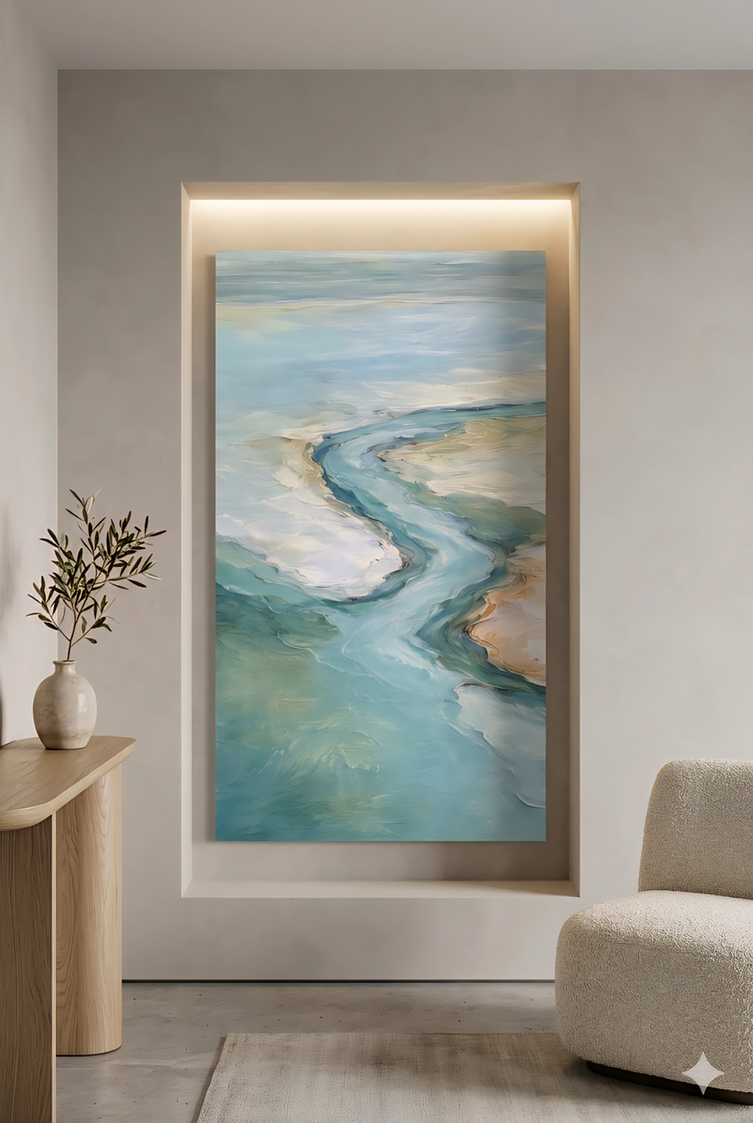 Modern coastal niche with large vertical ocean artwork, neutral decor, wood console and soft textured chair