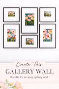 floral gallery wall bundle printable art set of 6 with soft pink and peach flower prints in black frames shown in symmetrical layout with create this gallery wall text overlay