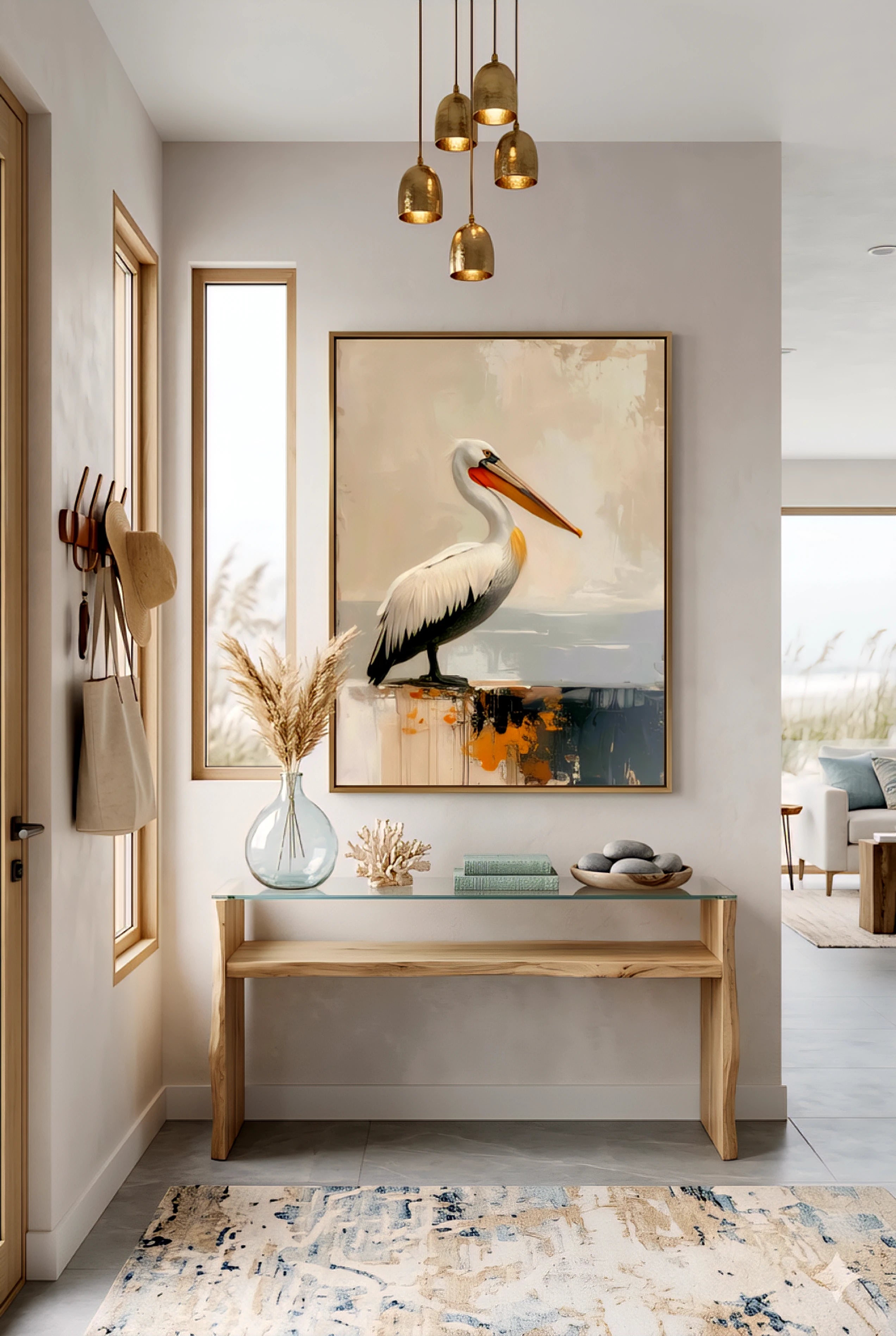 Coastal entryway decor with pelican wall art printable digital download above a modern console table in a beach house foyer.