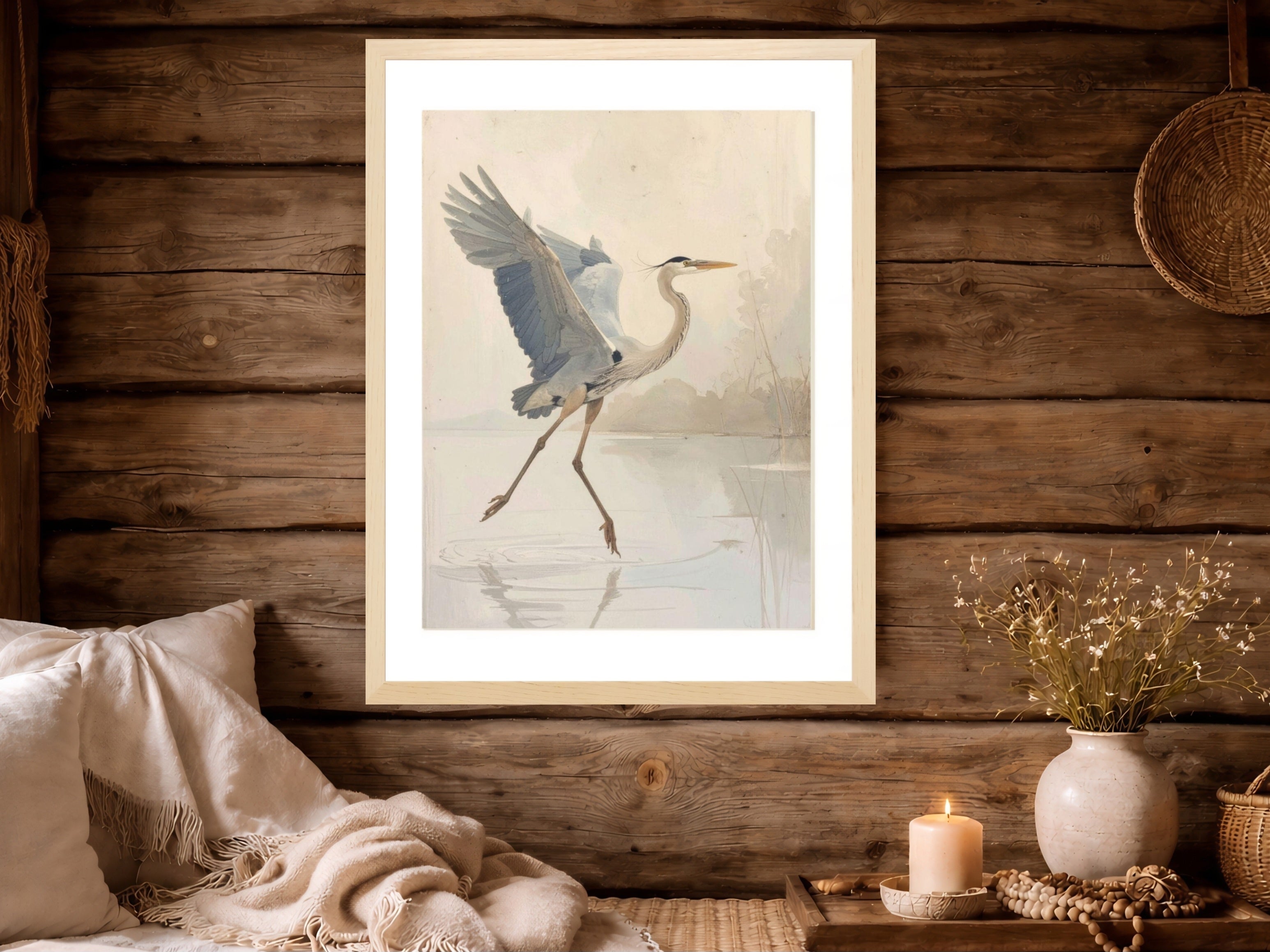 Framed artwork of a heron on a wooden wall with decorative items below.