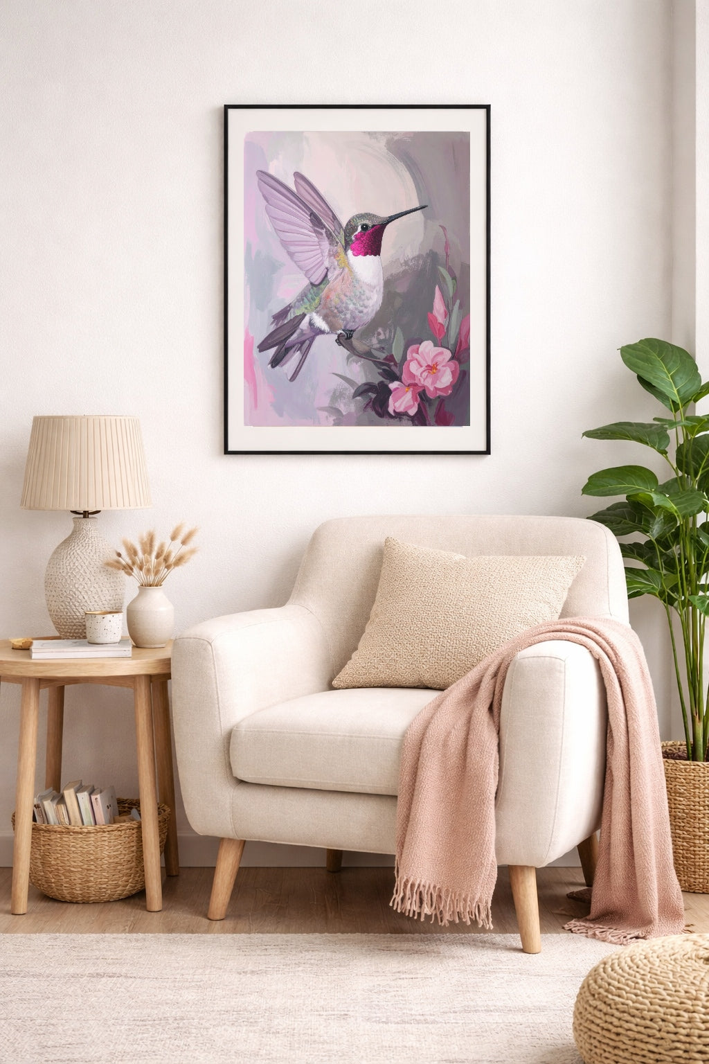 Hummingbird floral wall art in soft neutral reading nook with blush accents and cozy textures.