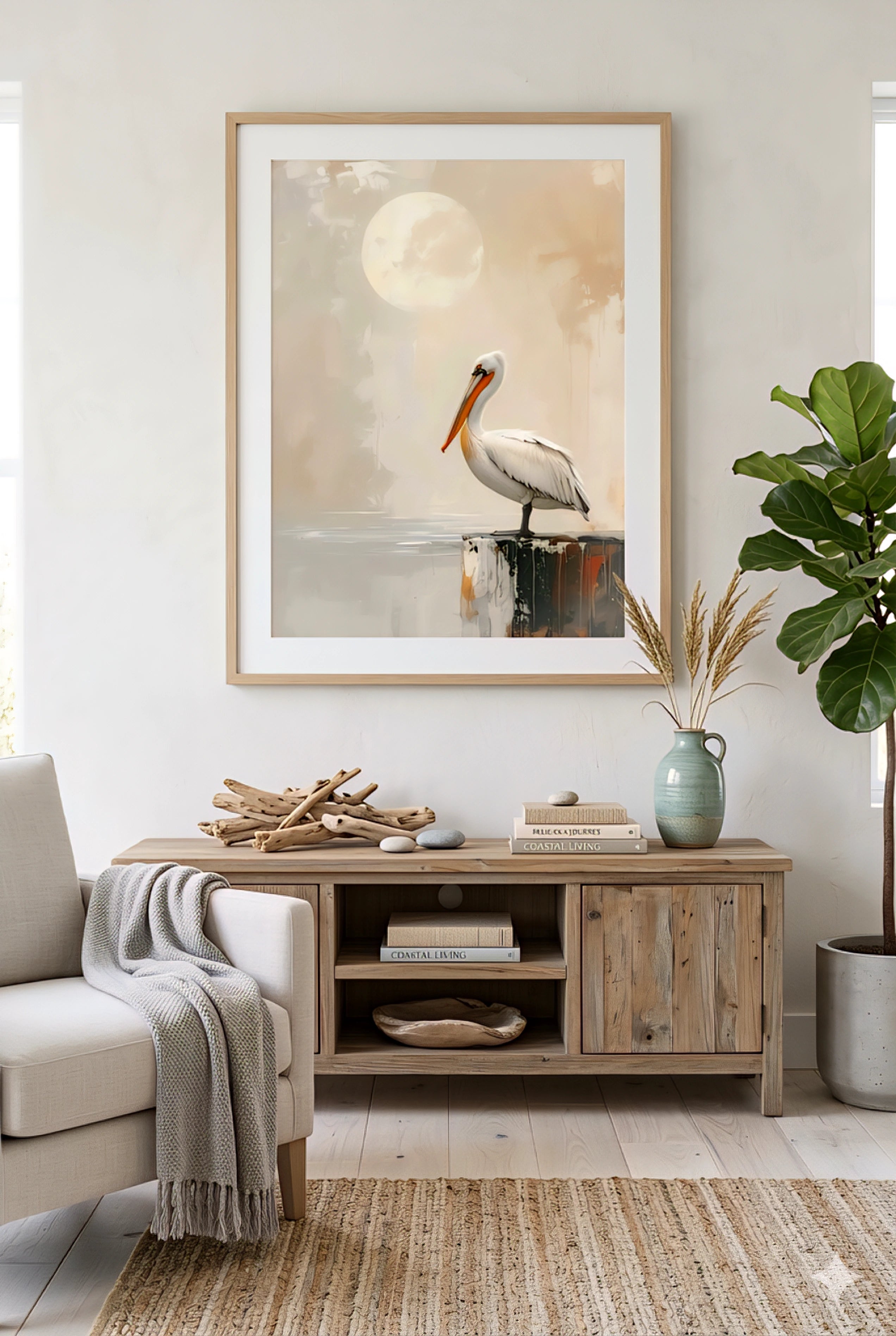 Coastal living room decor with pelican wall art printable digital download above a wood console table in a light beach house interior.