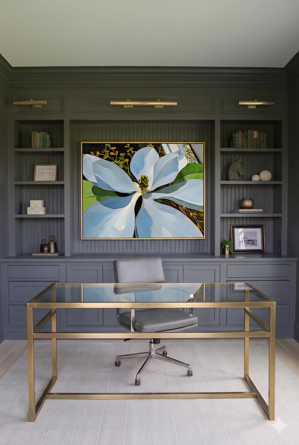 Magnolia wall art printable in modern home office, large white floral artwork above desk, botanical digital download, elegant workspace decor with built-in shelves, dark paneled walls and brass accents