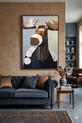 Large moose digital wall art in a modern living room with blue sofa, warm neutral walls, and layered textures creating a cozy, elevated design look
