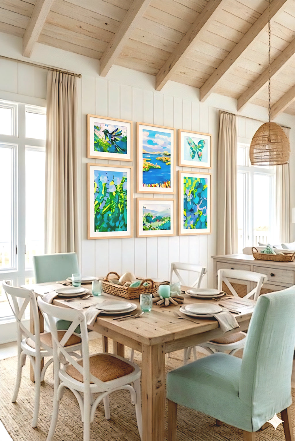 coastal gallery wall printable set styled in beach house dining room with light wood frames, blue green artwork creating a bright coastal decor look