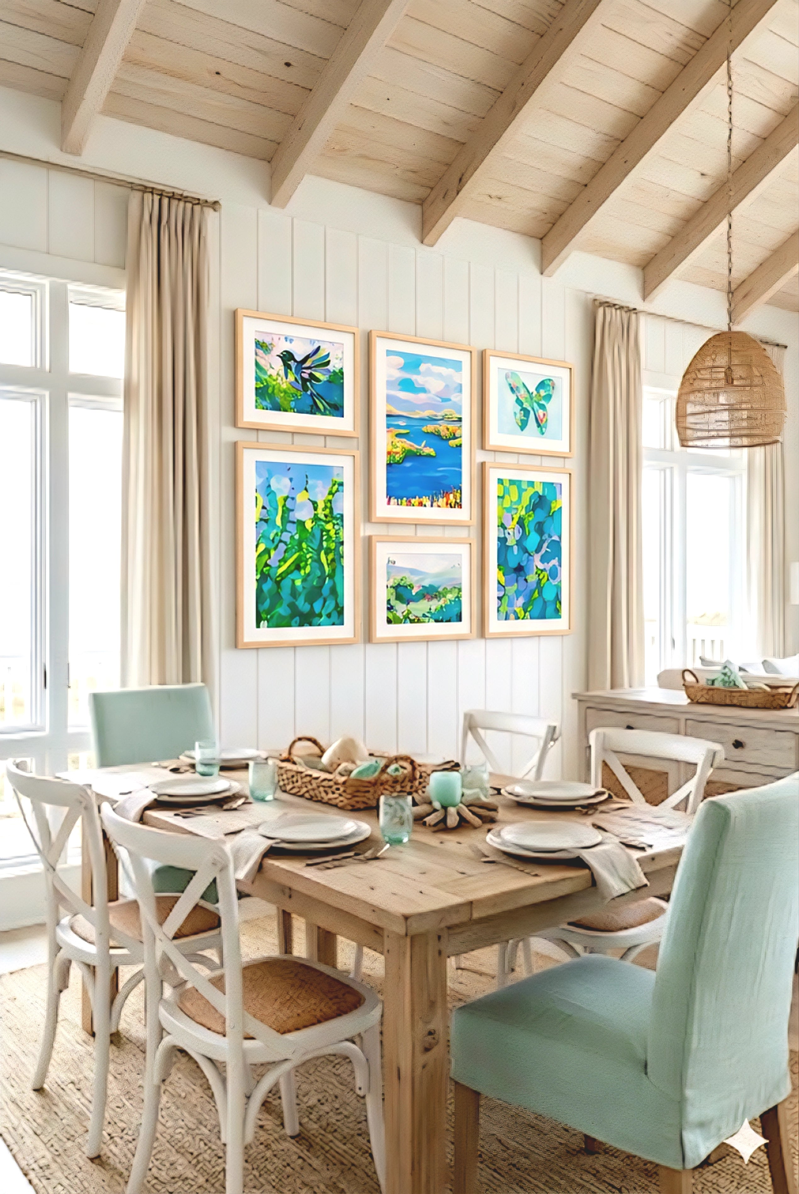 coastal gallery wall printable set styled in beach house dining room with light wood frames, blue green artwork creating a bright coastal decor look